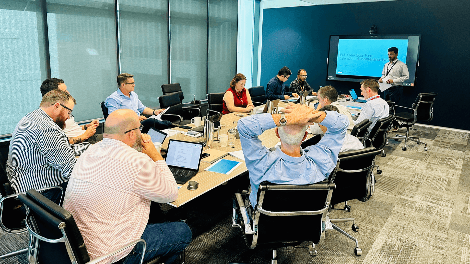 Group of business people working in board room